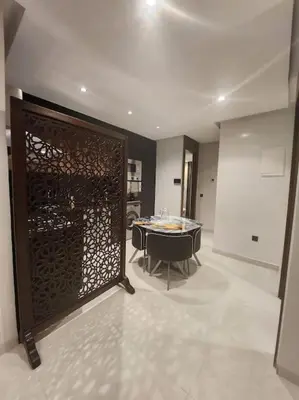 a room with a room with a table and a door at Élégance urbaine, Gueliz central in Marrakech