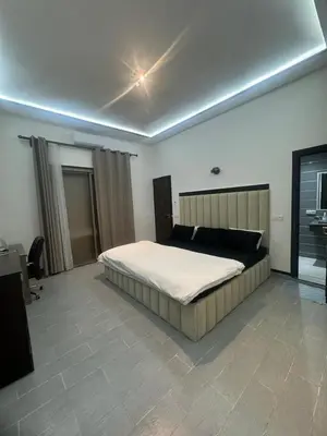 a bedroom with a large bed in a room at Villa S in Marrakech