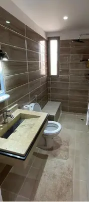 a bathroom with a toilet and a sink at Villa S in Marrakech
