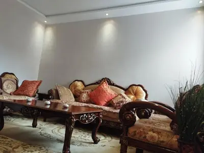 a living room with a couch and a coffee table at Appartement au centre Marrakech in Marrakech