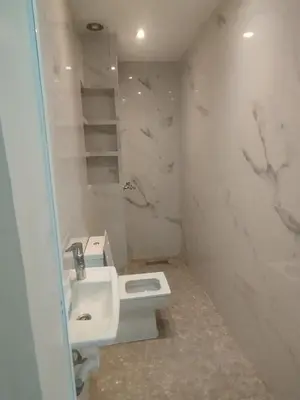 a bathroom with a sink and a toilet at Appartement au centre Marrakech in Marrakech