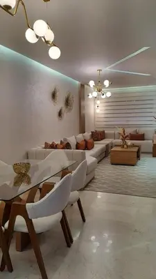 a large living room with couches and tables at Appartement luxueux marrakech in Marrakech