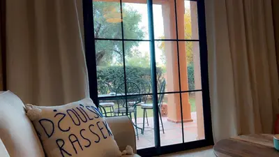 a room with a glass door leading to a patio at Dar Celya Sfia in Marrakech