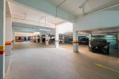 a parking garage with a car parked in it at Piscine Hivernage plein Centre in Marrakech