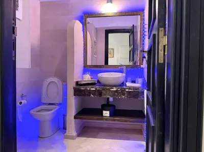 a bathroom with a sink and a toilet at Piscine Guéliz Center Yoga in Marrakech