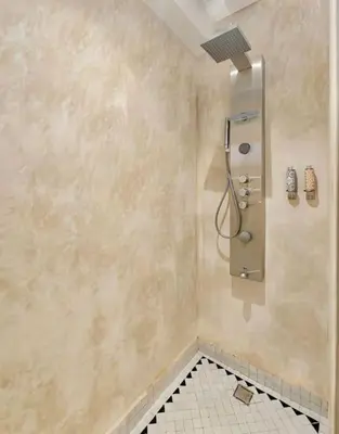 a bathroom with a shower with a tiled floor at Piscine Guéliz Center Yoga in Marrakech