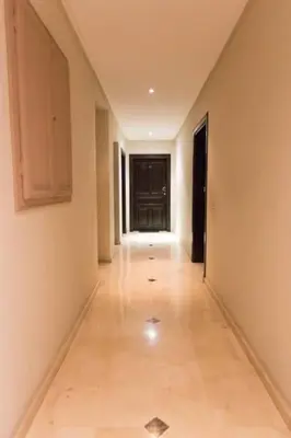 an empty hallway with a long room with a hallway at Piscine Guéliz Center Yoga in Marrakech