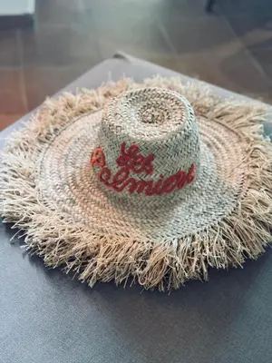 a straw hat sitting on top of a table at Gueliz Marrakech in Marrakech