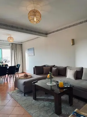 a living room with a couch and a table at Gueliz Marrakech in Marrakech