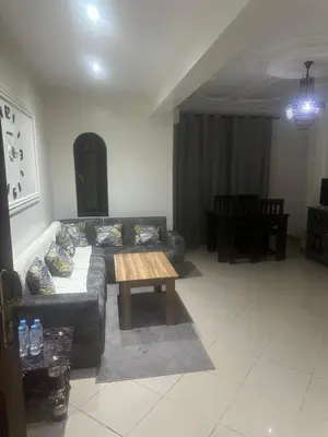 a living room with a couch and a coffee table at Appartement Lana Guéliz Marrakech in Marrakech