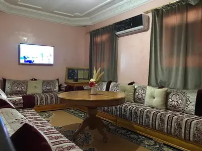 a living room with couches and a table at Dari in Marrakech
