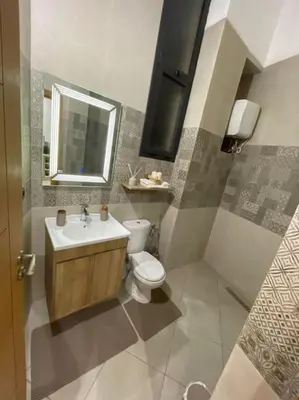 a bathroom with a toilet and a sink at La Bohéme - Duplex Neuf - Modern & Chic - Proche Gare - Confort - CLIM Parking et WIFI Gratuit ! GUELIZ in Marrakech