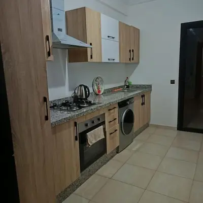 a kitchen with a stove and a stove top oven at superbe appartement à côté de la gare à Gueliz Marrakech in Marrakech
