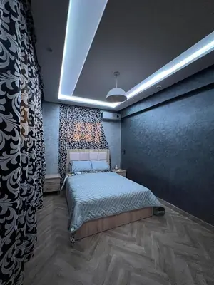 a bedroom with a bed in a room at Cozy Apartment near airport in Marrakech