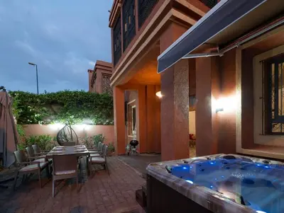 a jacuzzi tub in the courtyard of a house at Villa Targa in Marrakech