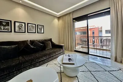 a living room with a couch and a table at Apartment in the heart of Marrakech in Marrakech