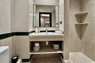 a bathroom with a sink and a mirror at Apartment in the heart of Marrakech in Marrakech