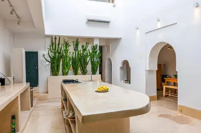 a kitchen with a island with bananas on a counter at Riad Orb Private Riad Breakfast Included in Marrakech