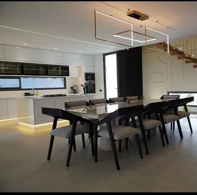 a kitchen and dining room with a table and chairs at Marrakech Oasis Retreat - 5-Bedroom Villa with Private Pool in El Makina