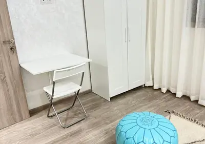 a room with a desk and a chair and a blue ball at Sérénité Berbère Appartement centre Marrakech in Marrakech