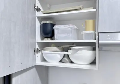 a cupboard with bowls and other kitchen utensils at Sérénité au coeur de Marrakech in Marrakech