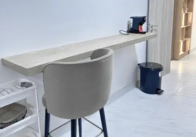 a counter with a chair in a room at Sérénité au coeur de Marrakech in Marrakech