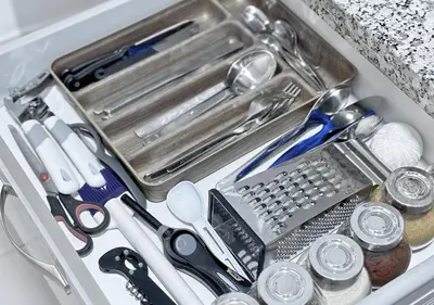 a drawer with scissors and other kitchen utensils in it at Sérénité au coeur de Marrakech in Marrakech