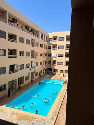 an overhead view of a swimming pool in a building at Cozy Nour in Marrakech