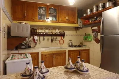 a kitchen with a counter with four vases on it at Riad Blue in Marrakech