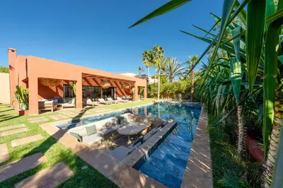 a swimming pool in the backyard of a house at Villa Baccarat - Piscine et Luxe in Marrakech