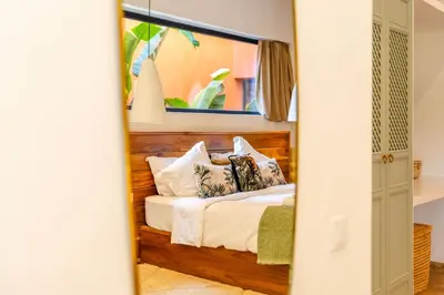 a bedroom with a bed with a wooden headboard at Villa Baccarat - Piscine et Luxe in Marrakech