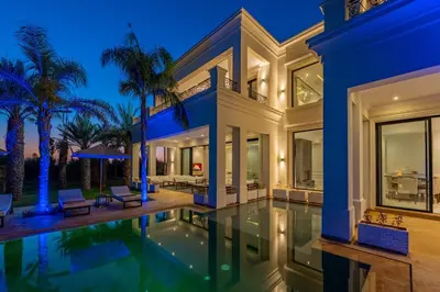 an exterior view of a house with a swimming pool at White Mansion in Tameslouht