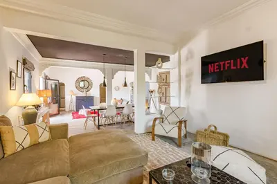 a living room with a couch and a table at Private villa Comfort and Relax Pool in Marrakech