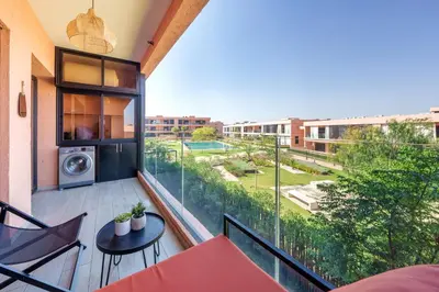an apartment balcony with a view of a building at Elegance and Serenity at Noria Golf and Pool view in Marrakech