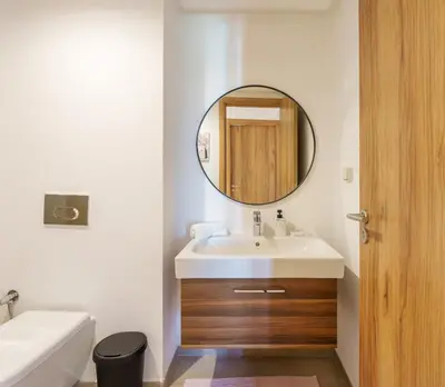 a bathroom with a sink and a mirror at Elegance and Serenity at Noria Golf and Pool view in Marrakech