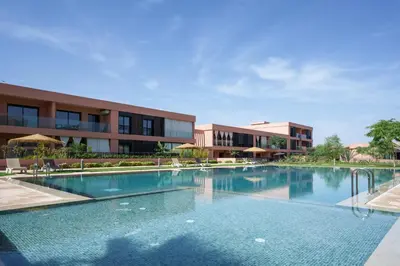 a large swimming pool in front of a building at Elegance and Serenity at Noria Golf and Pool view in Marrakech