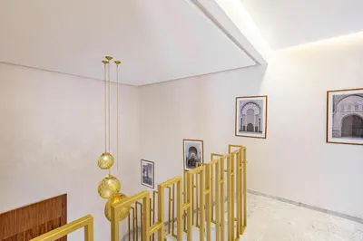 a room with stairs and pictures on the walls at Duplex Luxury and Comfort in Heart of Gueliz in Marrakech