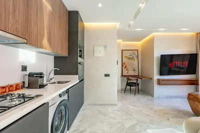 a kitchen with a sink and a stove top oven at elegance et modernite au coeur de la ville in Marrakech