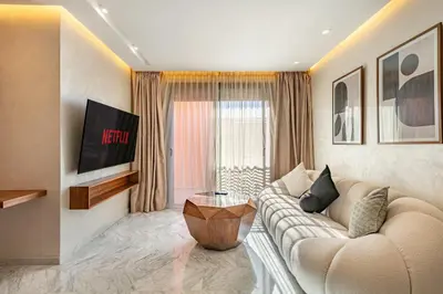 a living room with a couch and a table at elegance et modernite au coeur de la ville in Marrakech