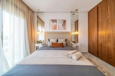 a bedroom with a large bed with towels on it at Bohemian Style in Hyper-Center - Optical Fiber in Marrakech