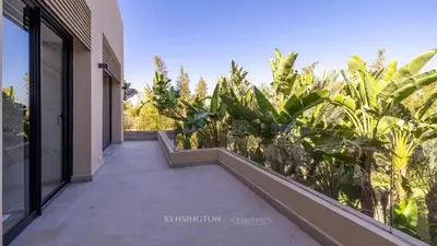 a balcony of a house with a garden at VilLA AYDEN in Marrakech