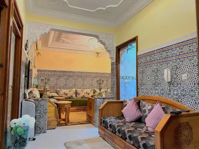 a living room with a couch in a room at cozy Apartment Near Airport in Marrakech