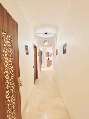 an empty hallway with a door and a hallway sidx sidx at New Apartment in Guéliz, Pool, Balcony & Parking in Marrakech