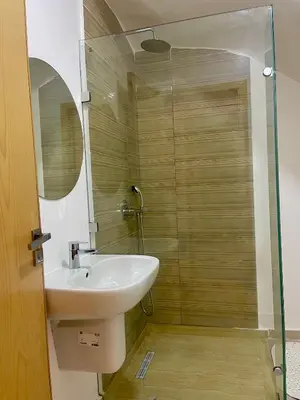 a bathroom with a sink and a shower at Duplex chic et cosy avec piscine in Marrakech