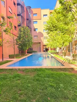 a swimming pool in the middle of a building at STUDIO luxueux COSY FAMILY in Marrakech