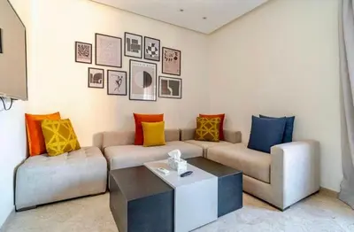 a living room with a couch and a coffee table at Appart Chambre et Salon Gueliz Marrakech Alia1 in Marrakech
