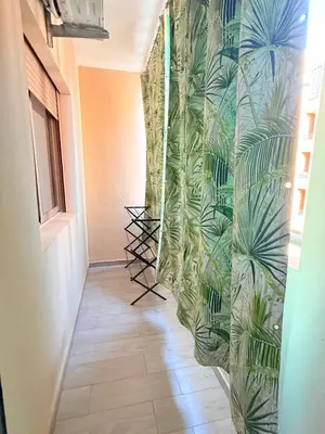 a hallway with a green wall with plants at N7 Confort Cosy Près De Gueliz in Marrakech