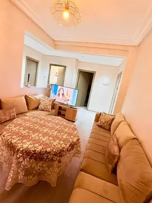 a living room with a couch and a table at N7 Confort Cosy Près De Gueliz in Marrakech