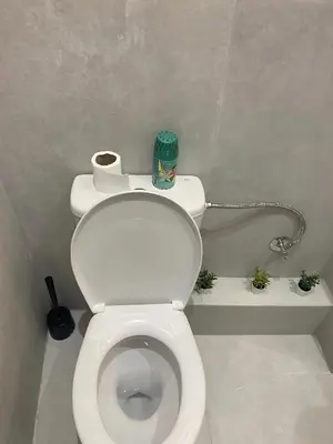 a bathroom with a toilet with a roll of toilet paper at Centre ville Gueliz Plaza Marrakech in Marrakech