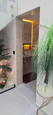 a view of a room with a mirror and a plant at Duplexe de luxe Gueliz in Marrakech
